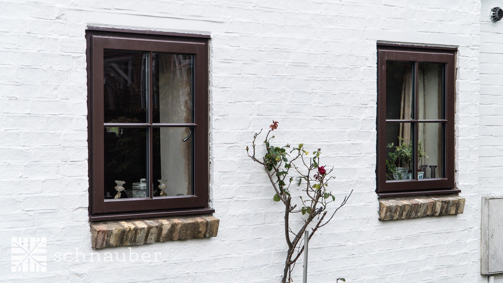 Dark aluminium clad timber windows - virtually maintenance free