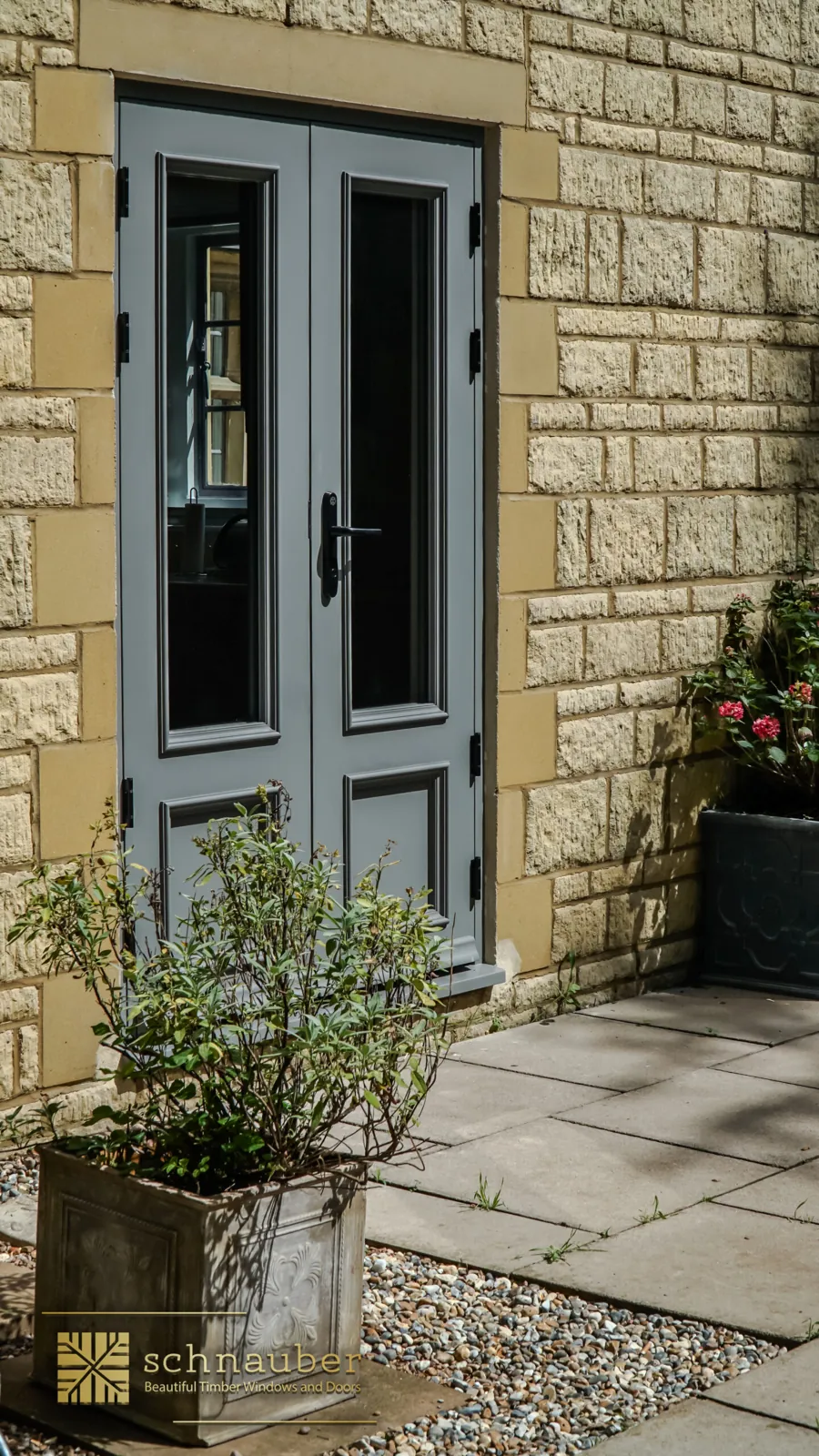 Grey timber French doors with black handles