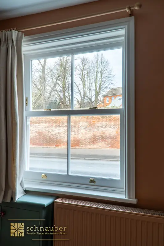 White timber sash window seen from inside